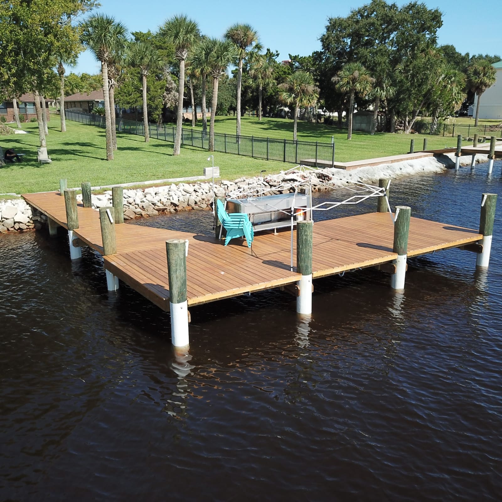 Canal-side fishing dock with hardwood decking and SnapJacket® bases