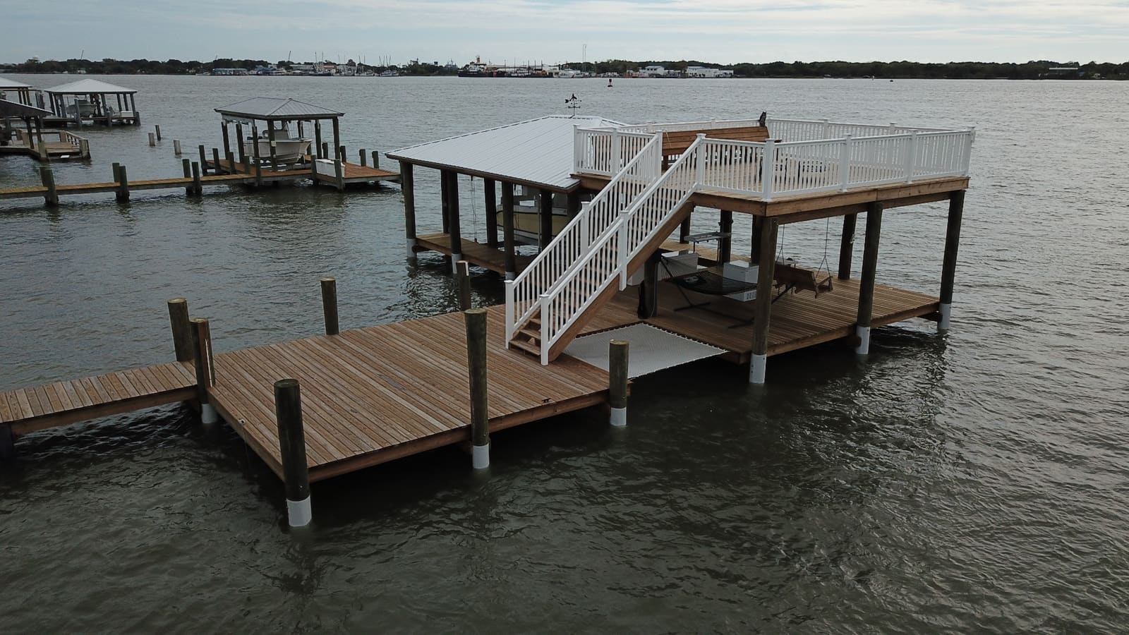 Two-story dock with upper sundeck and SnapJacket®-protected pilings