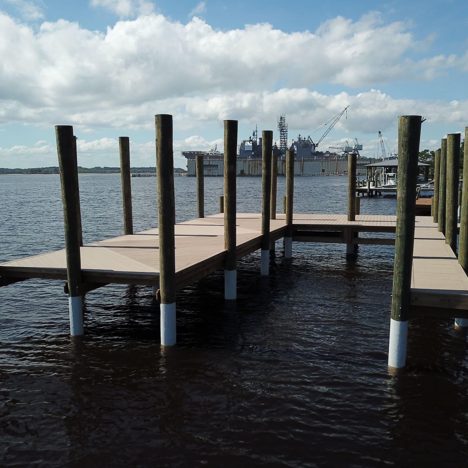 Fresh pilings and composite decking, ready for the next build phase