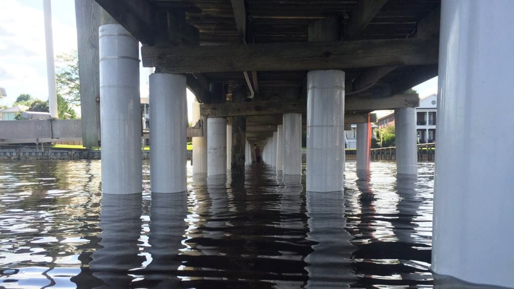 Same dock pilings reinforced with white SnapJacket composite jackets